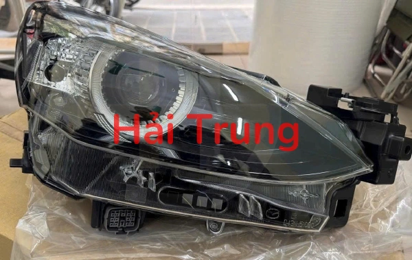 DHM6510K0F Đèn pha Mazda 2 2014 2015 2016
